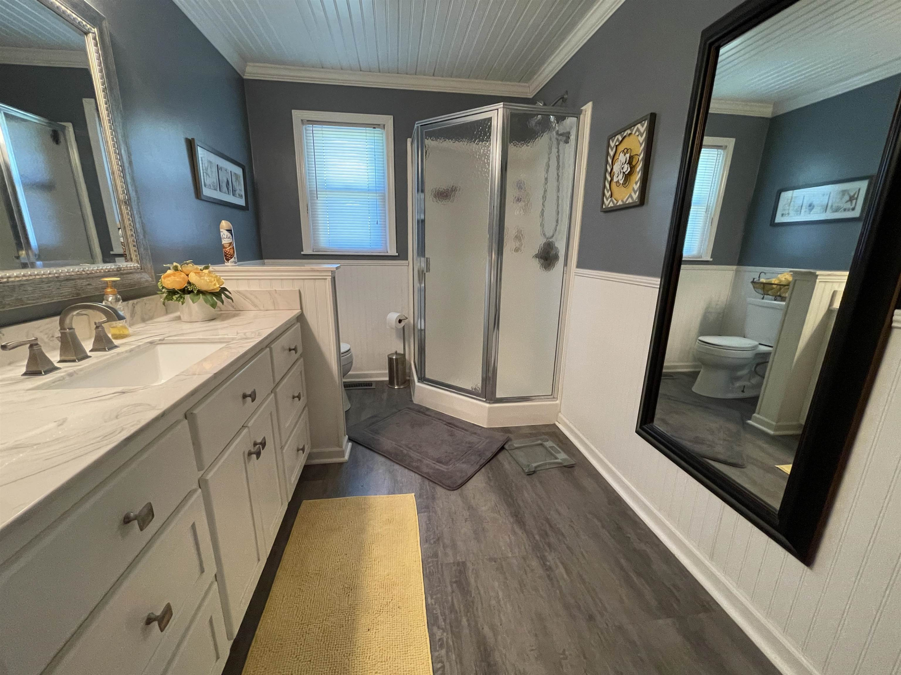 2507 East Grove Road Gleason, TN 38229 - Photo 15 of 37 a spacious bathroom with a double vanity sink and a mirror