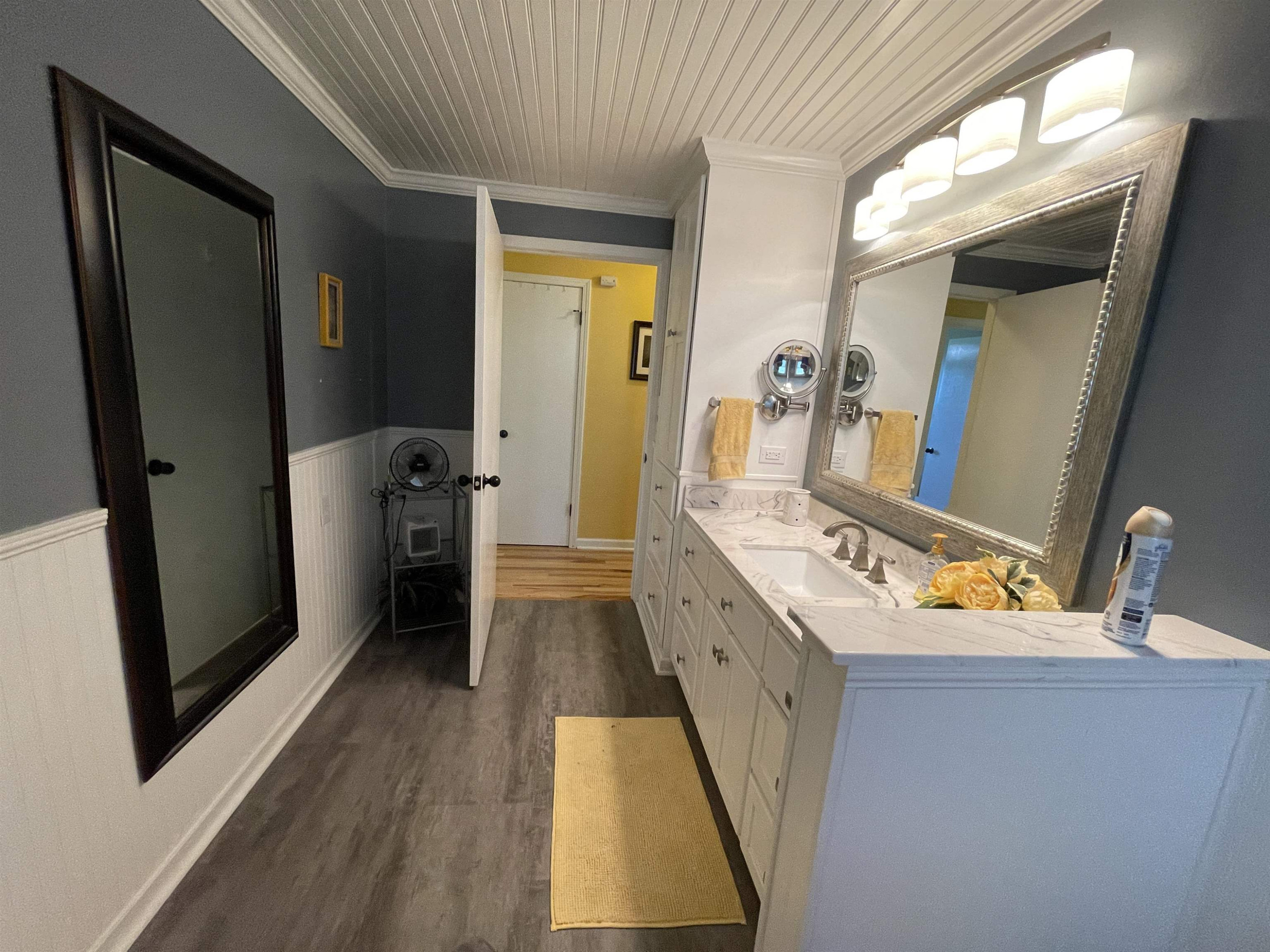 2507 East Grove Road Gleason, TN 38229 - Photo 17 of 37 a bathroom with a sink a mirror and a toilet