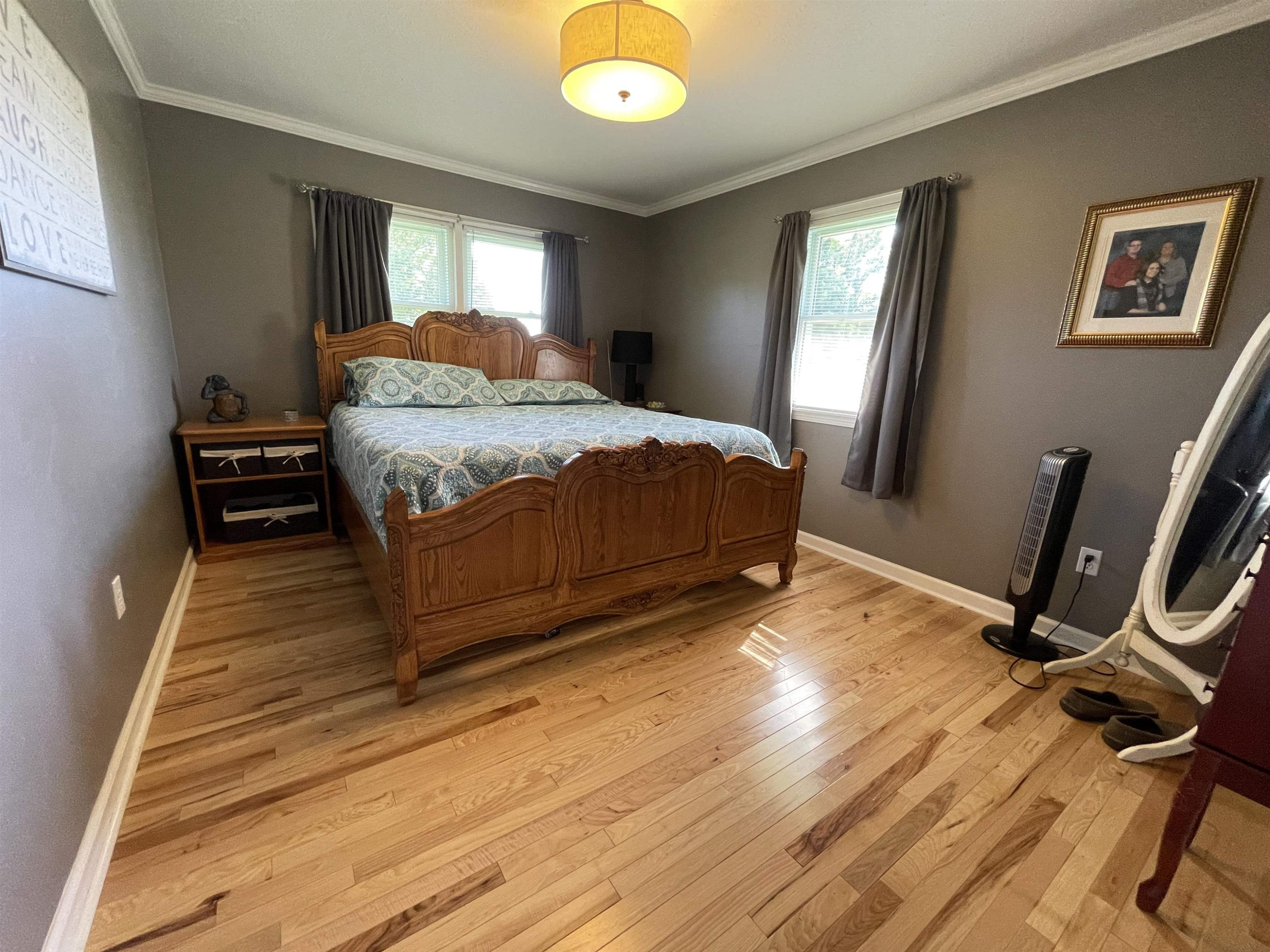 2507 East Grove Road Gleason, TN 38229 - Photo 18 of 37 a bedroom with a bed and wooden floor