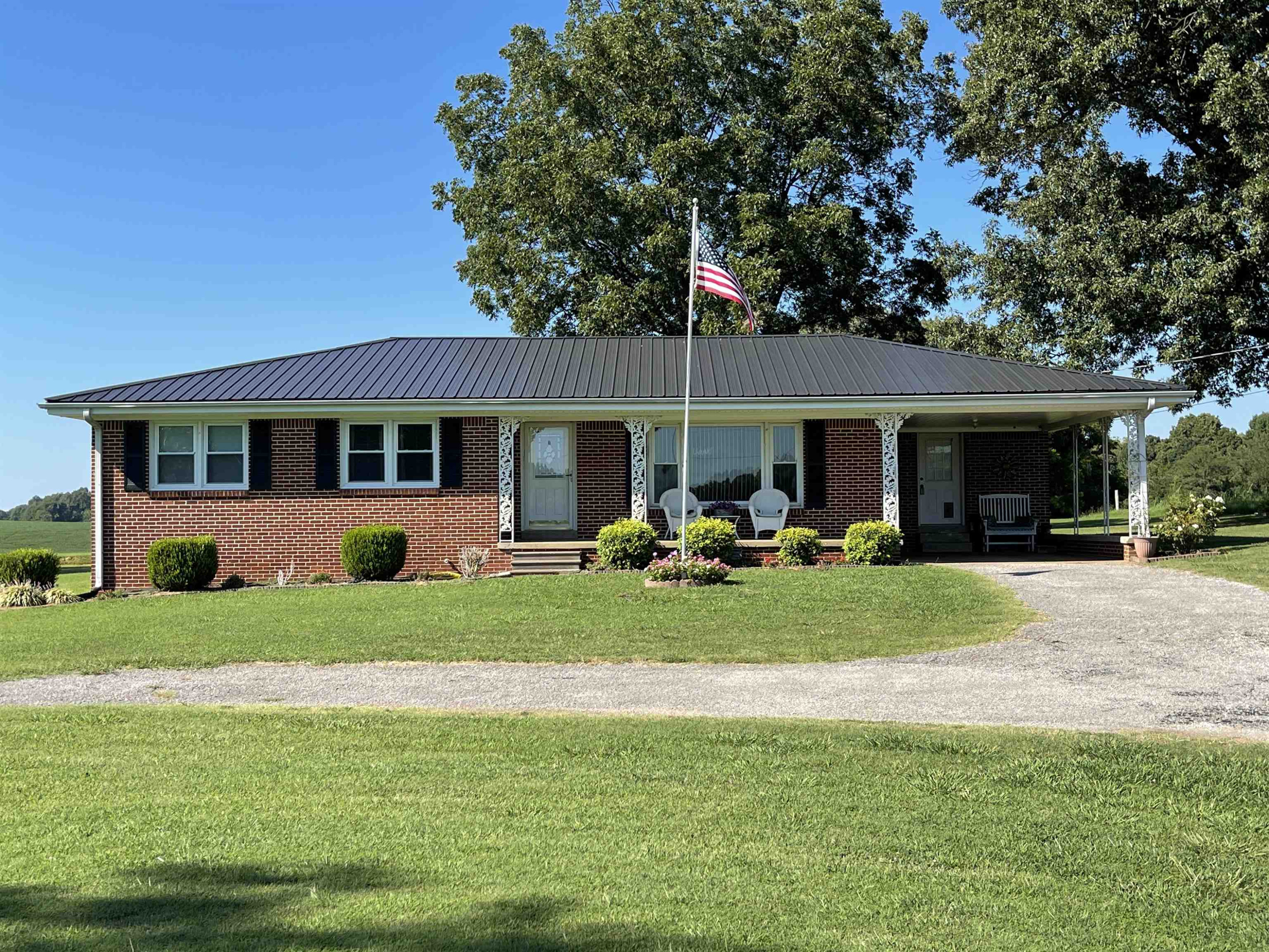 2507 East Grove Road Gleason, TN 38229 - Photo 2 of 37 a view of a house with a yard and sitting area