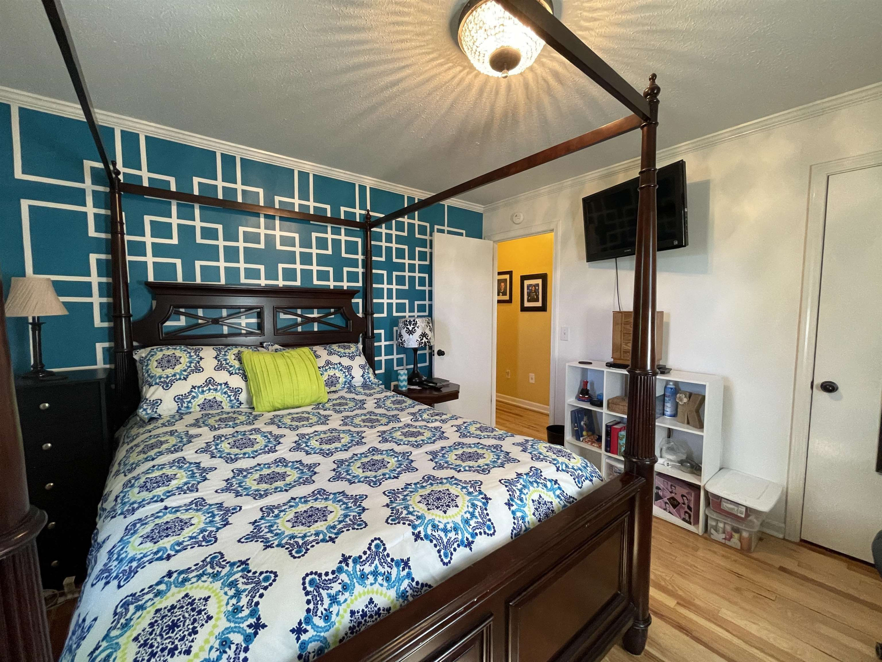 2507 East Grove Road Gleason, TN 38229 - Photo 21 of 37 a bedroom with a bed and wooden floor