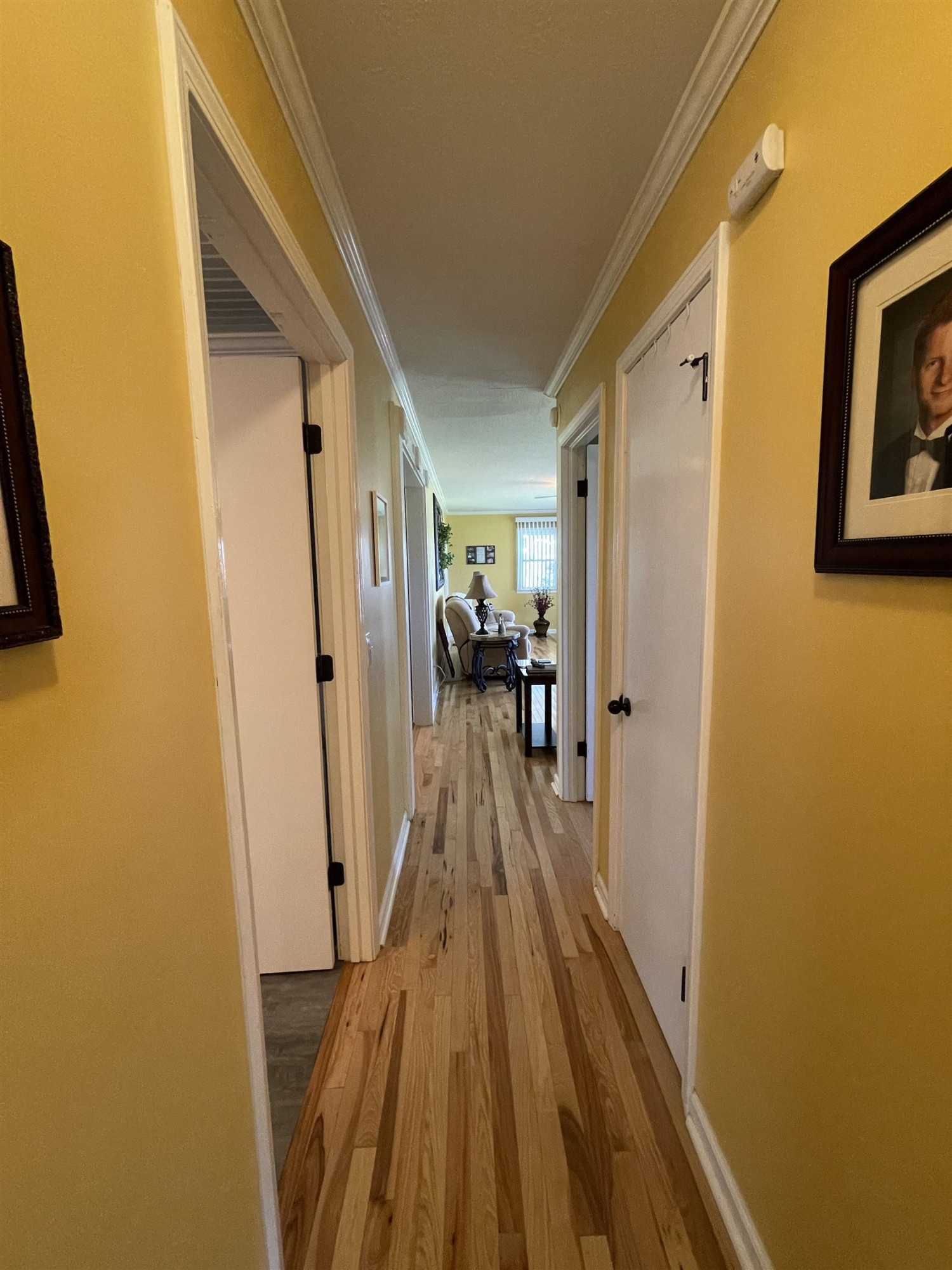 2507 East Grove Road Gleason, TN 38229 - Photo 22 of 37 a view of a hallway with wooden floor and a living room
