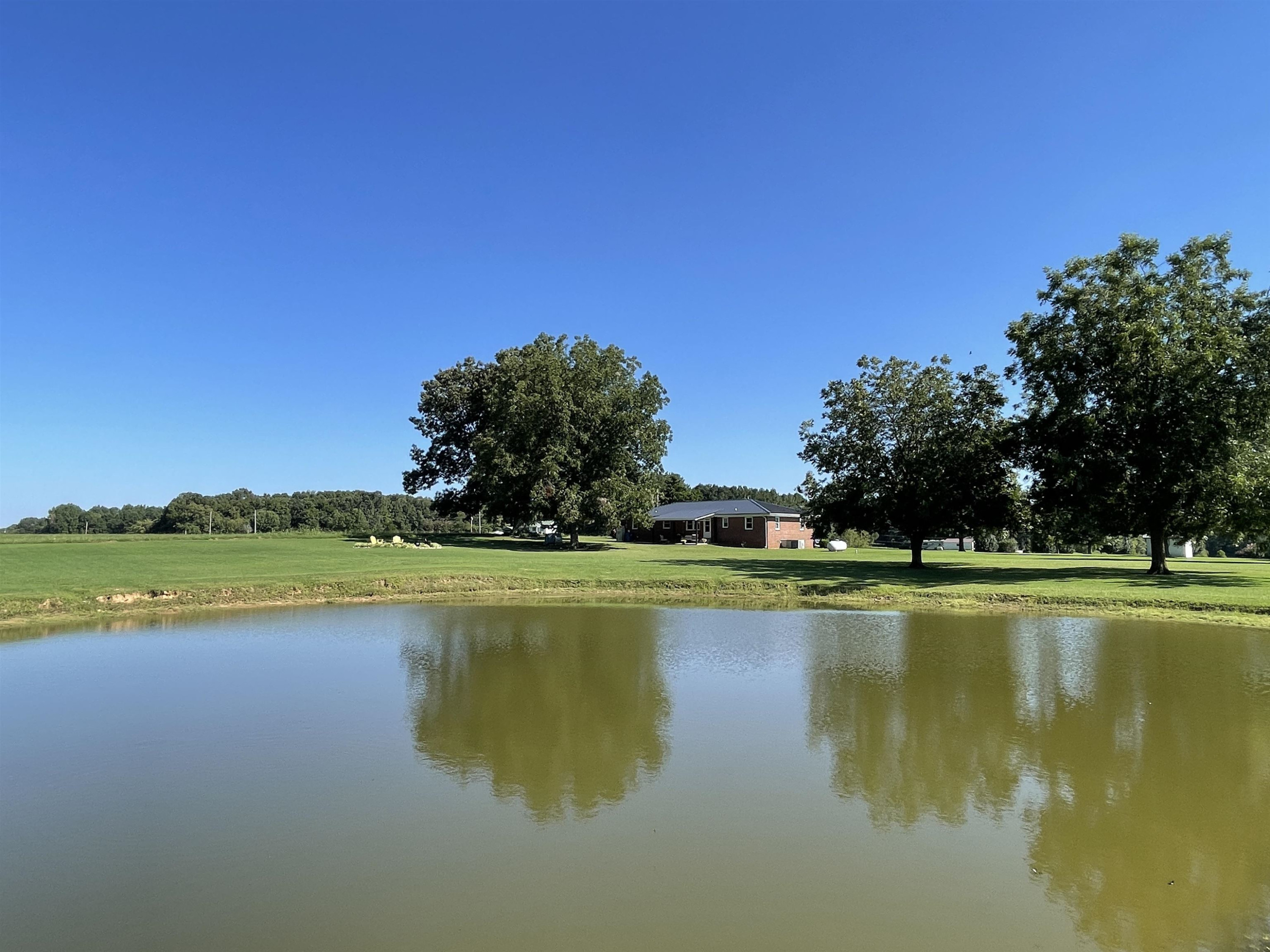 2507 East Grove Road Gleason, TN 38229 - Photo 30 of 37 a view of a lake with houses in the background