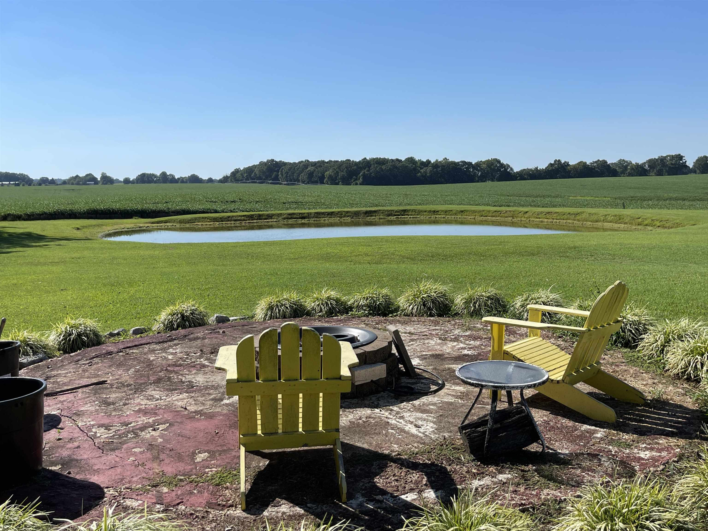 2507 East Grove Road Gleason, TN 38229 - Photo 32 of 37 a view of a lake with a table and chairs
