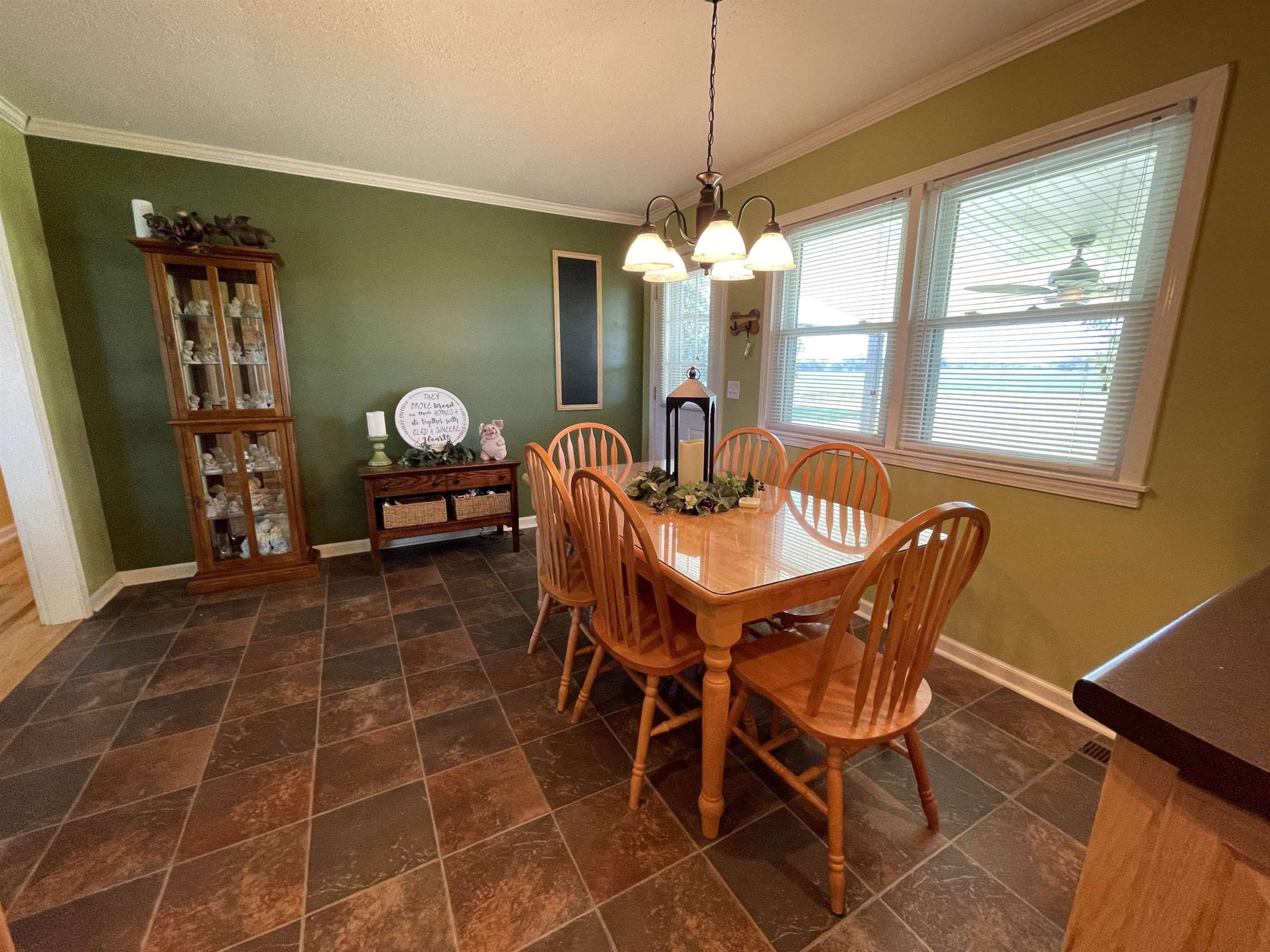 2507 East Grove Road Gleason, TN 38229 - Photo 8 of 37 a dining room with furniture a chandelier and window
