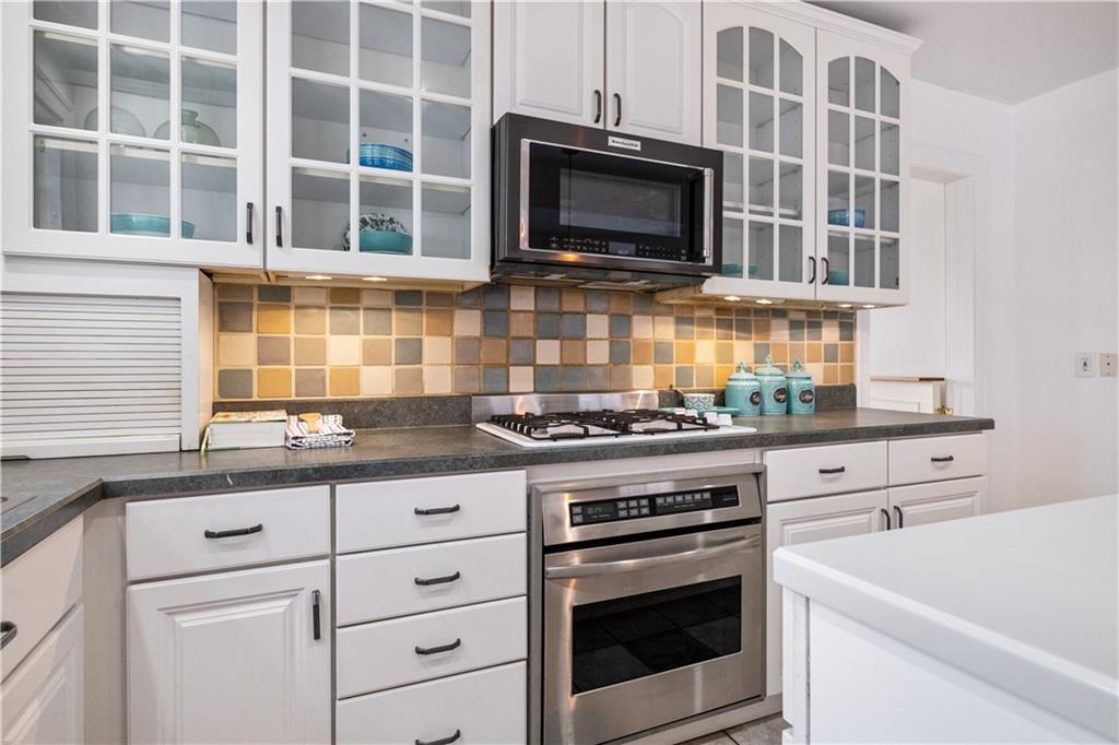4305 Centre Pittsburgh, PA 15213 - Photo 18 of 47 a kitchen with cabinets stainless steel appliances and a sink