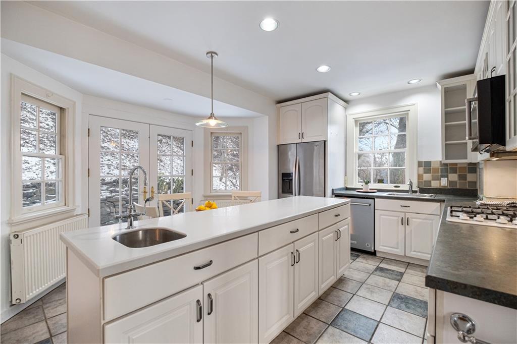 4305 Centre Pittsburgh, PA 15213 - Photo 19 of 47 a kitchen with a sink stove and cabinets