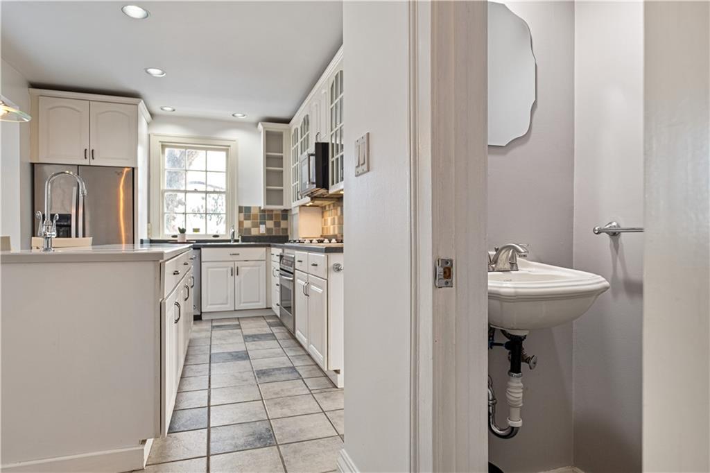4305 Centre Pittsburgh, PA 15213 - Photo 22 of 47 a kitchen with white cabinets and sink