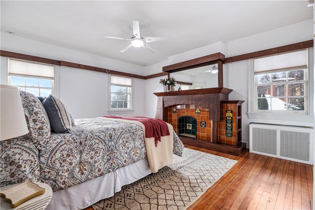 4305 Centre Pittsburgh, PA 15213 - Photo 23 of 47 a bedroom with a bed and a fireplace