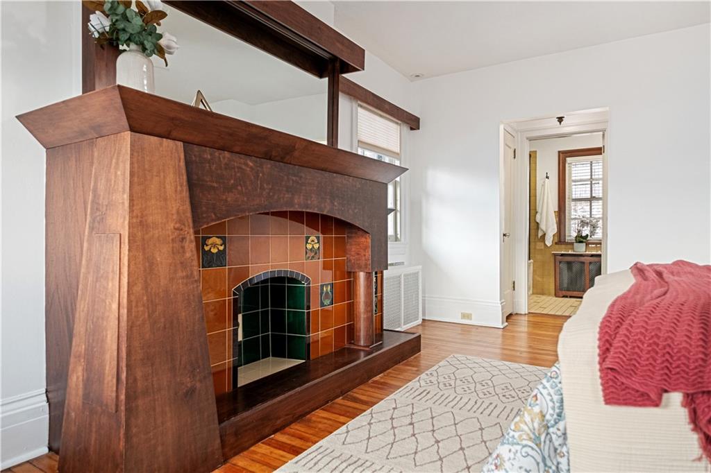 4305 Centre Pittsburgh, PA 15213 - Photo 25 of 47 a living room with a fireplace furniture and a rug