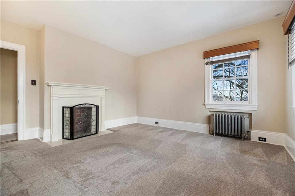 4305 Centre Pittsburgh, PA 15213 - Photo 30 of 47 a view of an empty room with a fireplace
