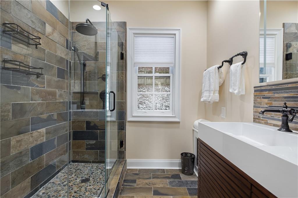 4305 Centre Pittsburgh, PA 15213 - Photo 31 of 47 a bathroom with a sink and a mirror