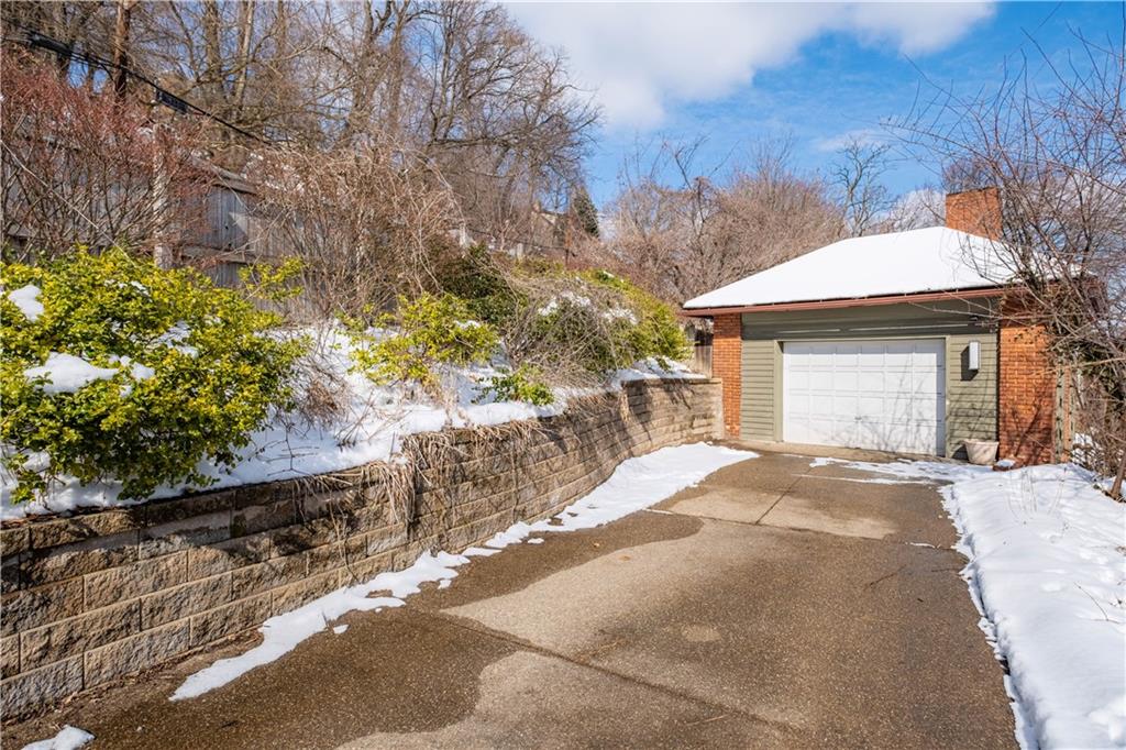 4305 Centre Pittsburgh, PA 15213 - Photo 45 of 47 a front view of a house with a yard and garage