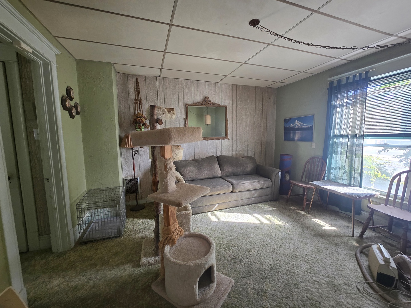 157-159 West Hickory Street Kankakee, IL 60901 - Photo 11 of 33 a living room with furniture a window and a table