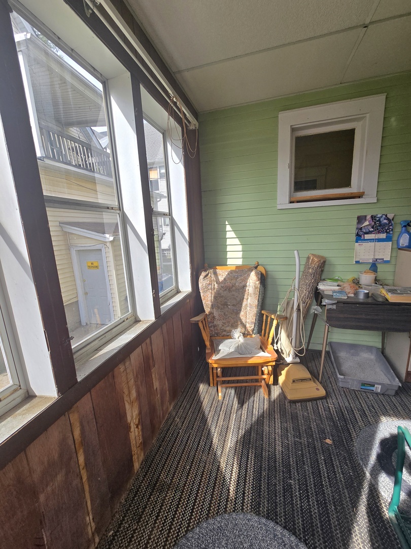 157-159 West Hickory Street Kankakee, IL 60901 - Photo 12 of 33 a view of a dining room with furniture window and wooden floor