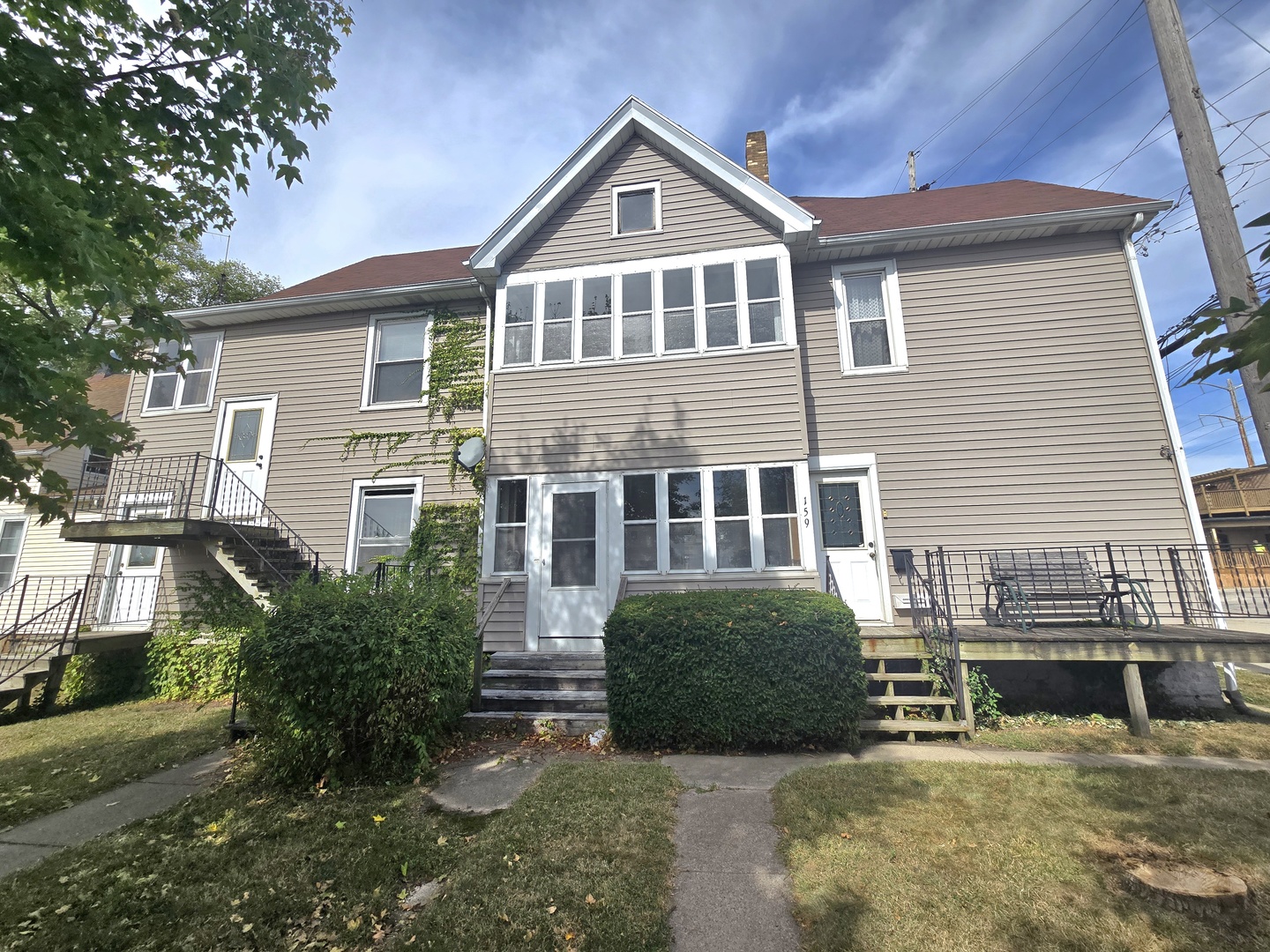157-159 West Hickory Street Kankakee, IL 60901 - Photo 2 of 33 a front view of a house with a yard