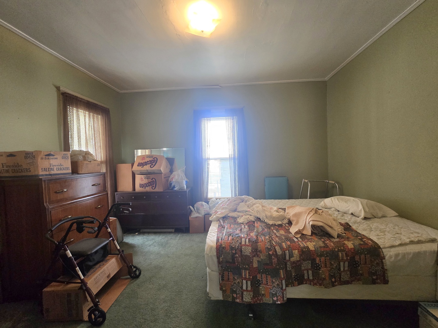 157-159 West Hickory Street Kankakee, IL 60901 - Photo 27 of 33 a bedroom with a bed and a window