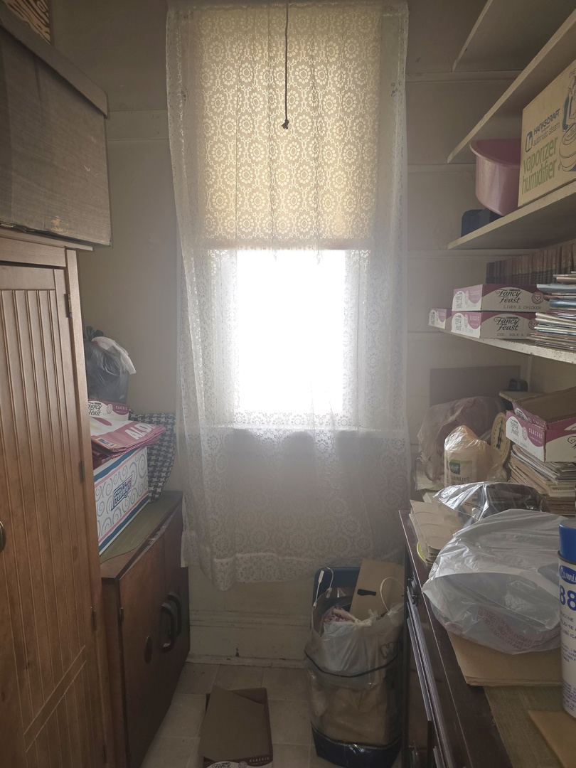 157-159 West Hickory Street Kankakee, IL 60901 - Photo 29 of 33 a bathroom with a sink and a mirror