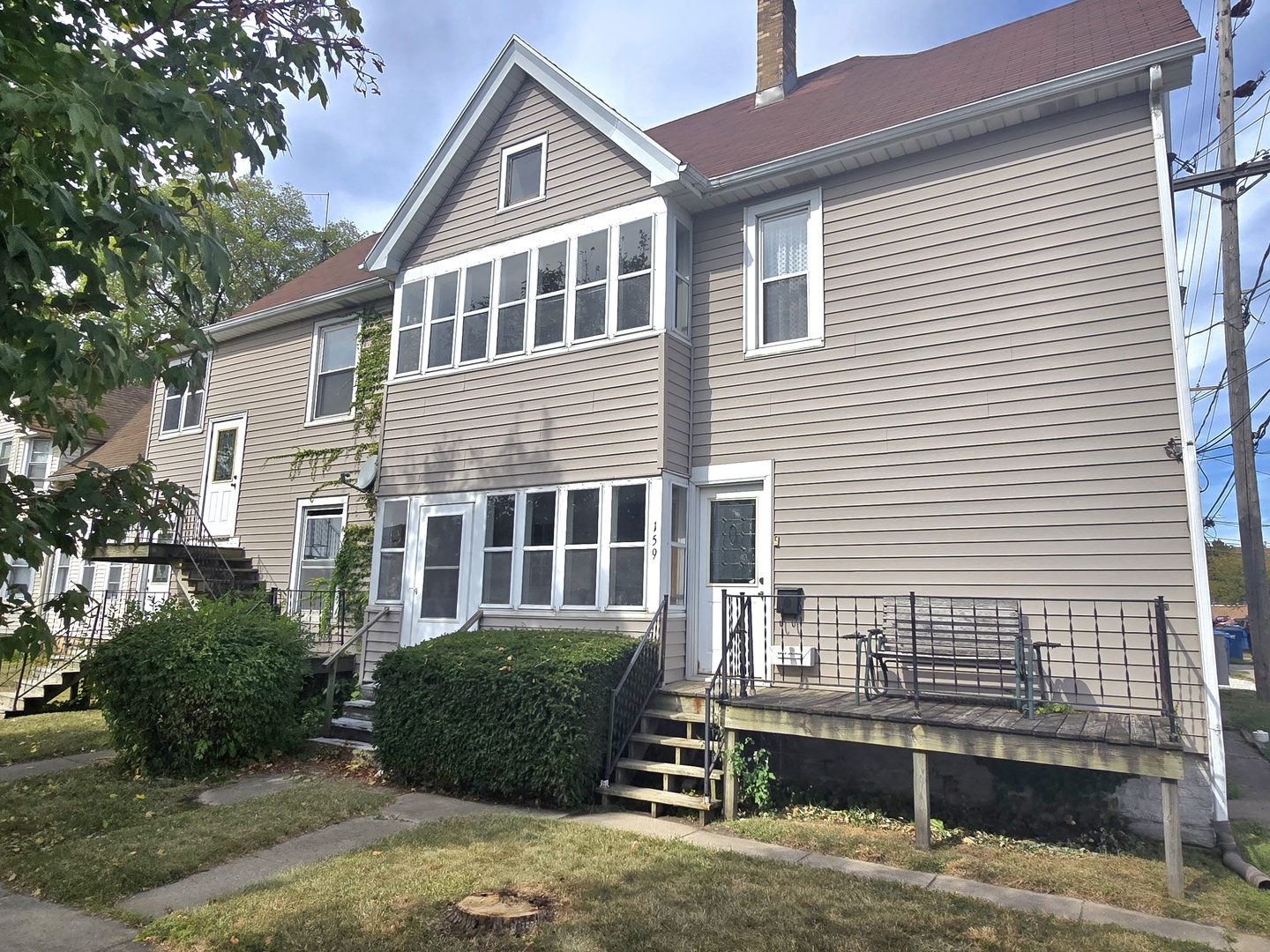 157-159 West Hickory Street Kankakee, IL 60901 - Photo 32 of 33 a front view of a house with a yard