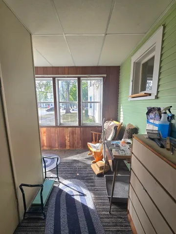 a work room with furniture and windows