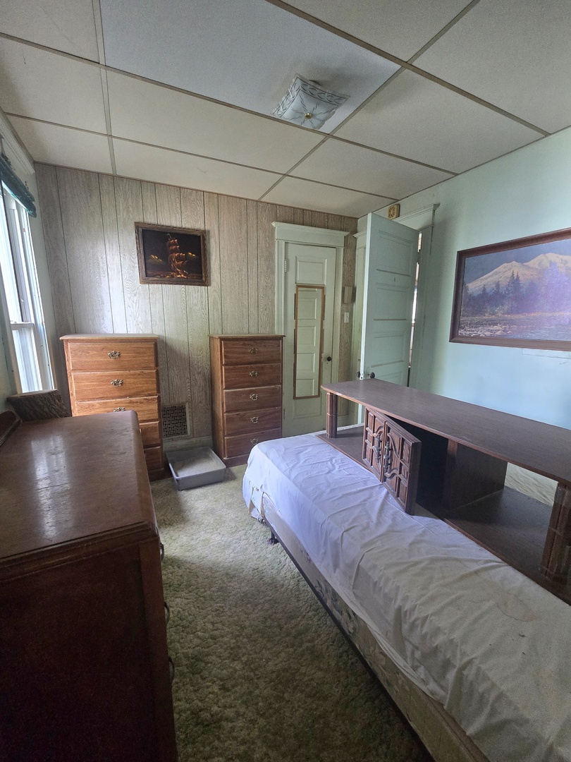 157-159 West Hickory Street Kankakee, IL 60901 - Photo 8 of 33 a bedroom with furniture and a window