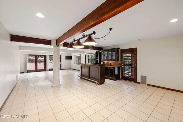 a aerial view of a house with a yard and sitting area