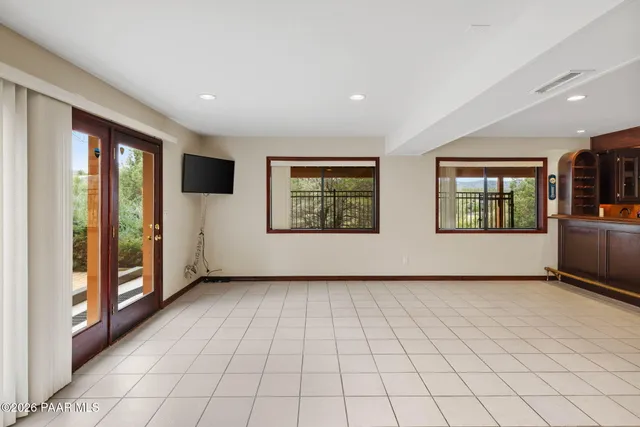 a view of balcony with furniture and wooden floor