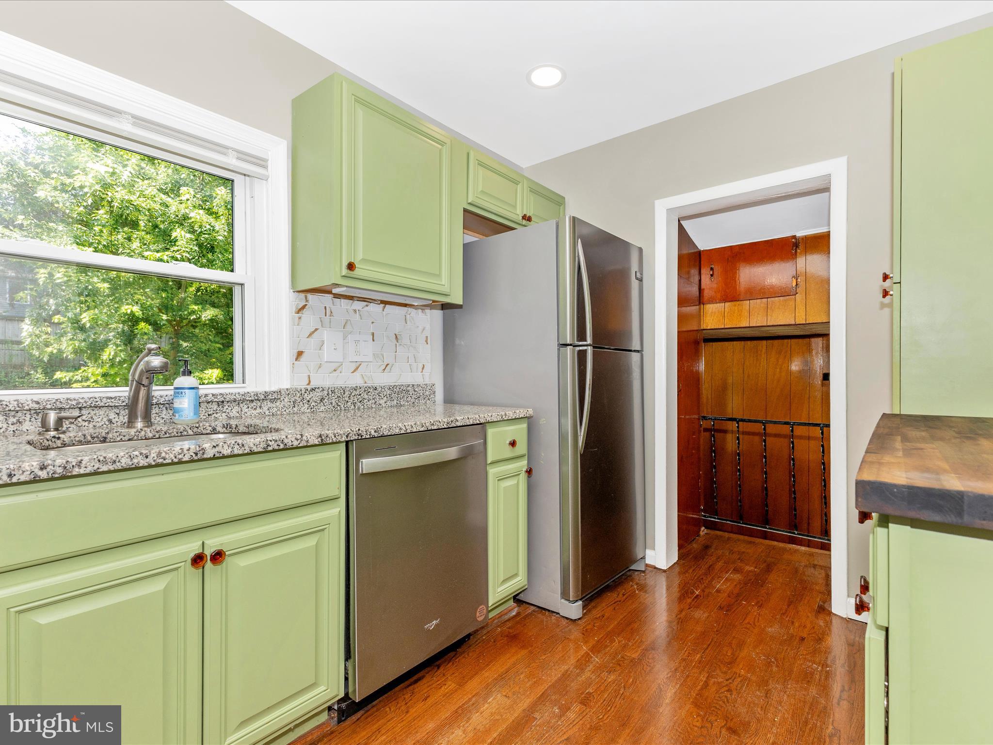 12230 Selfridge Road Silver Spring, MD 20906 - Photo 11 of 49 a kitchen with stainless steel appliances granite countertop a refrigerator and a sink