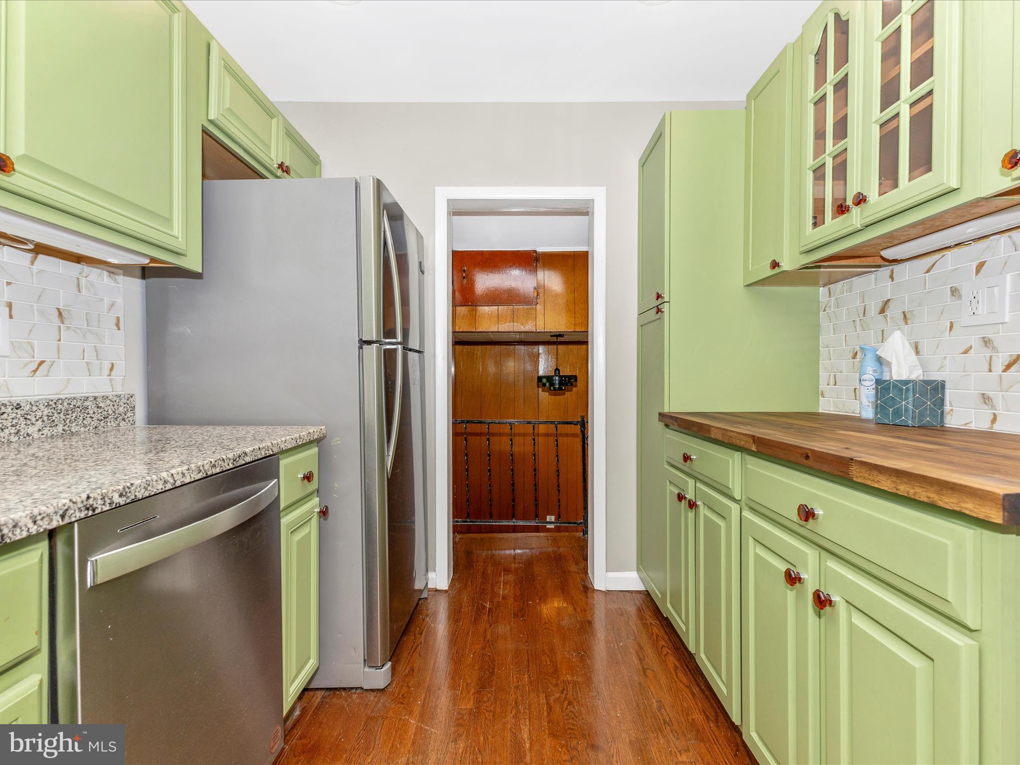 12230 Selfridge Road Silver Spring, MD 20906 - Photo 14 of 49 a kitchen with stainless steel appliances granite countertop a refrigerator and a sink