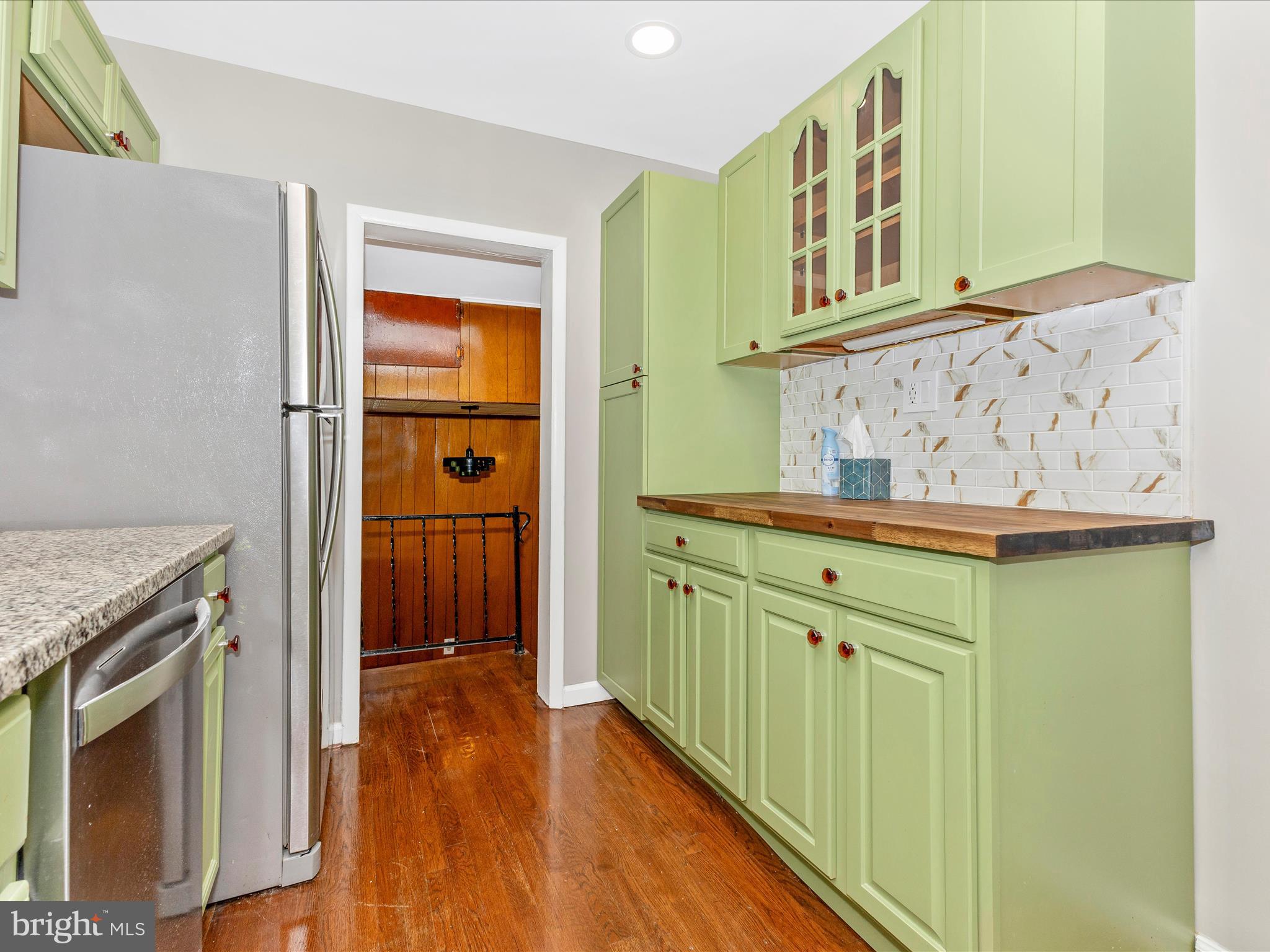 12230 Selfridge Road Silver Spring, MD 20906 - Photo 15 of 49 a view of a kitchen with fridge and wooden floor