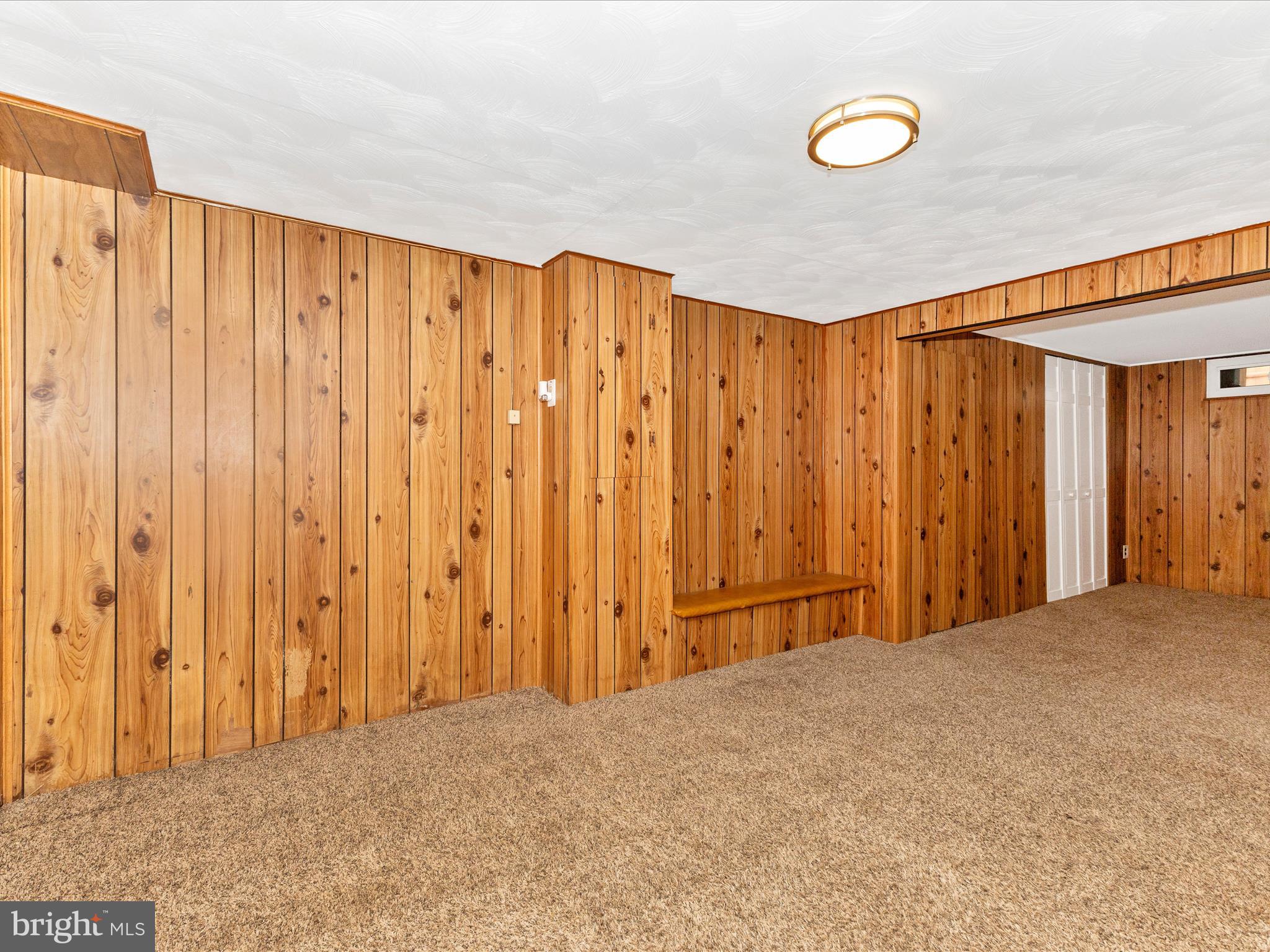 12230 Selfridge Road Silver Spring, MD 20906 - Photo 20 of 49 a view of an empty room with wooden walls