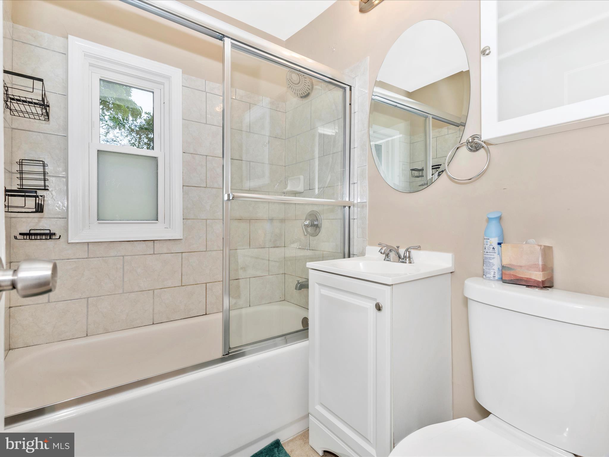 12230 Selfridge Road Silver Spring, MD 20906 - Photo 31 of 49 a bathroom with a sink a toilet and shower
