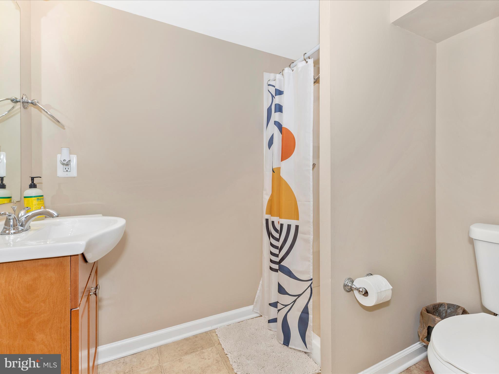 12230 Selfridge Road Silver Spring, MD 20906 - Photo 35 of 49 a bathroom with a sink toilet and vanity