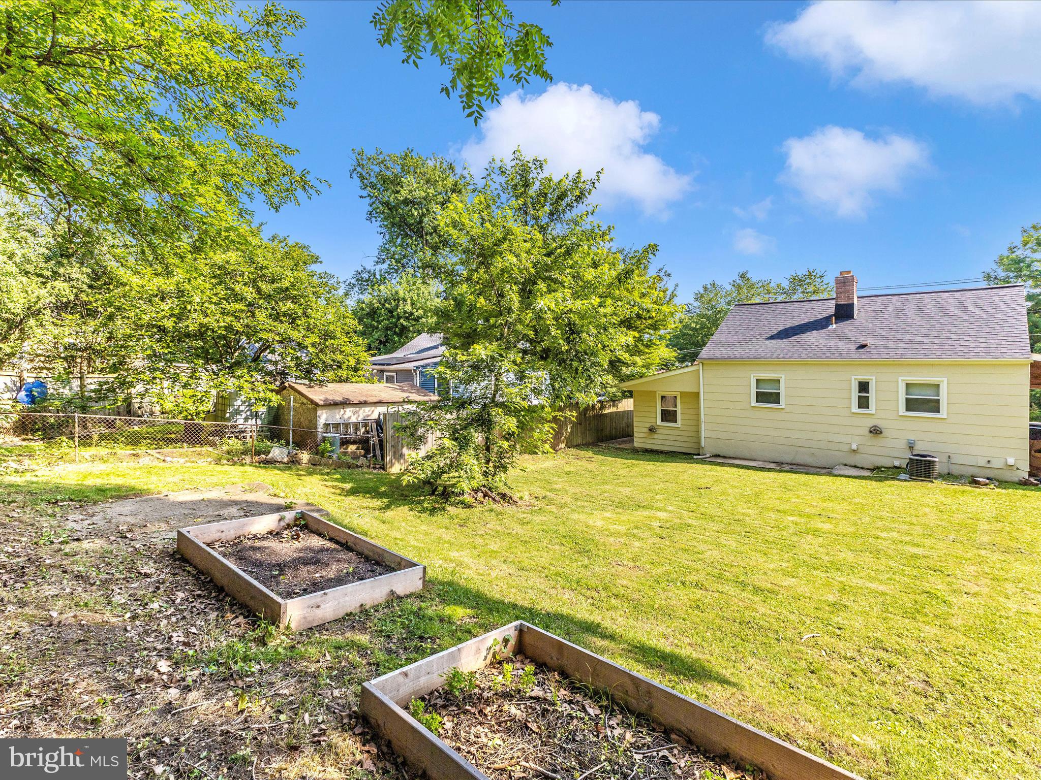 12230 Selfridge Road Silver Spring, MD 20906 - Photo 42 of 49 a front view of a house with a yard