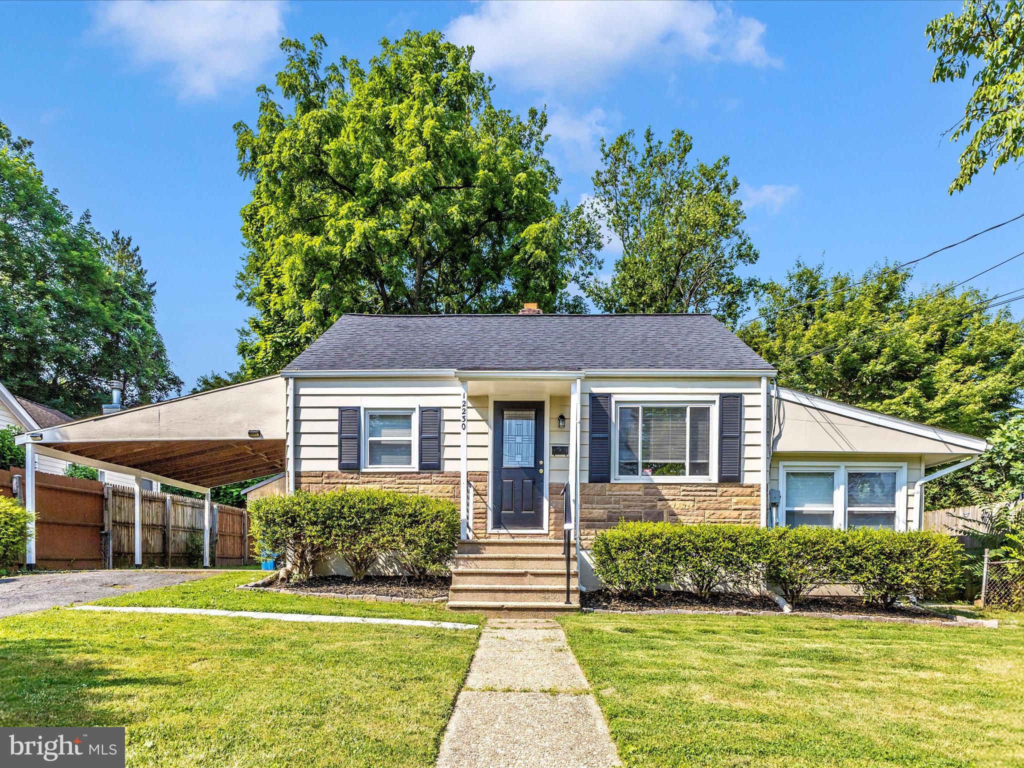 12230 Selfridge Road Silver Spring, MD 20906 - Photo 47 of 49 a front view of a house with a yard