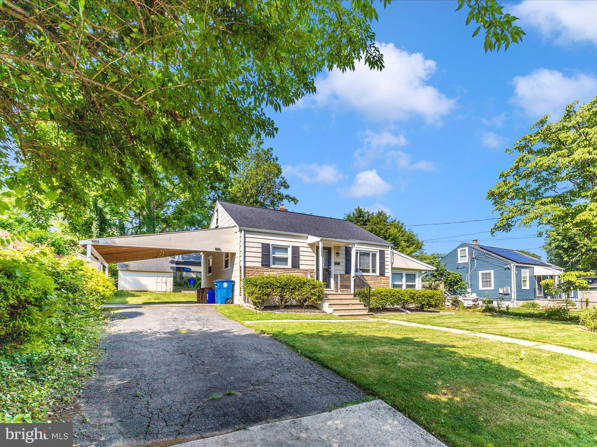 12230 Selfridge Road Silver Spring, MD 20906 - Photo 48 of 49 front view of a house with a yard