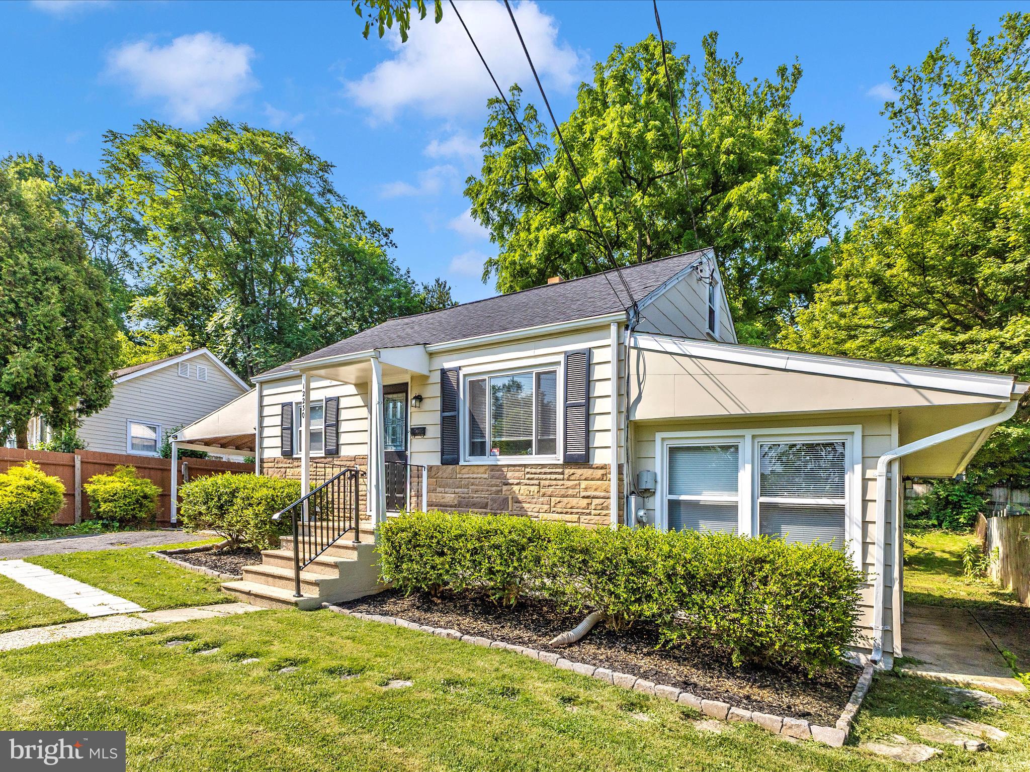 12230 Selfridge Road Silver Spring, MD 20906 - Photo 49 of 49 front view of a house with a yard