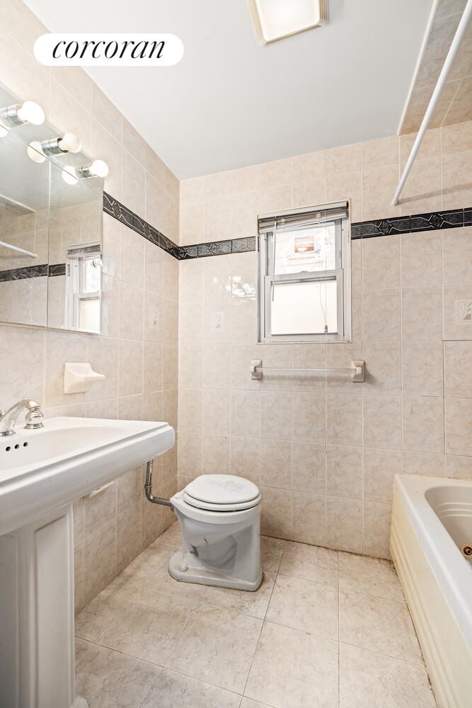 187-23 Brinkerhoff Avenue Queens, NY 11412 - Photo 5 of 10 a bathroom with a sink a toilet and shower