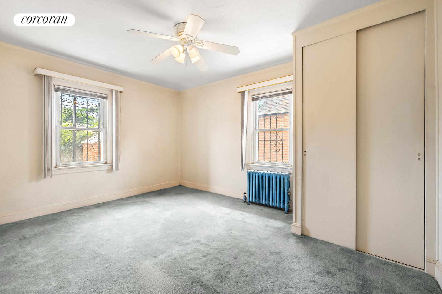 187-23 Brinkerhoff Avenue Queens, NY 11412 - Photo 6 of 10 an empty room with windows and closet