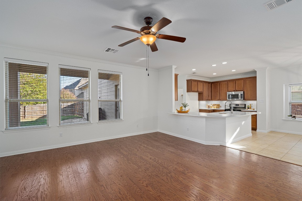 422 Village Commons Boulevard Georgetown, TX 78633 - Photo 11 of 40 a view of kitchen with window and stainless steel appliances