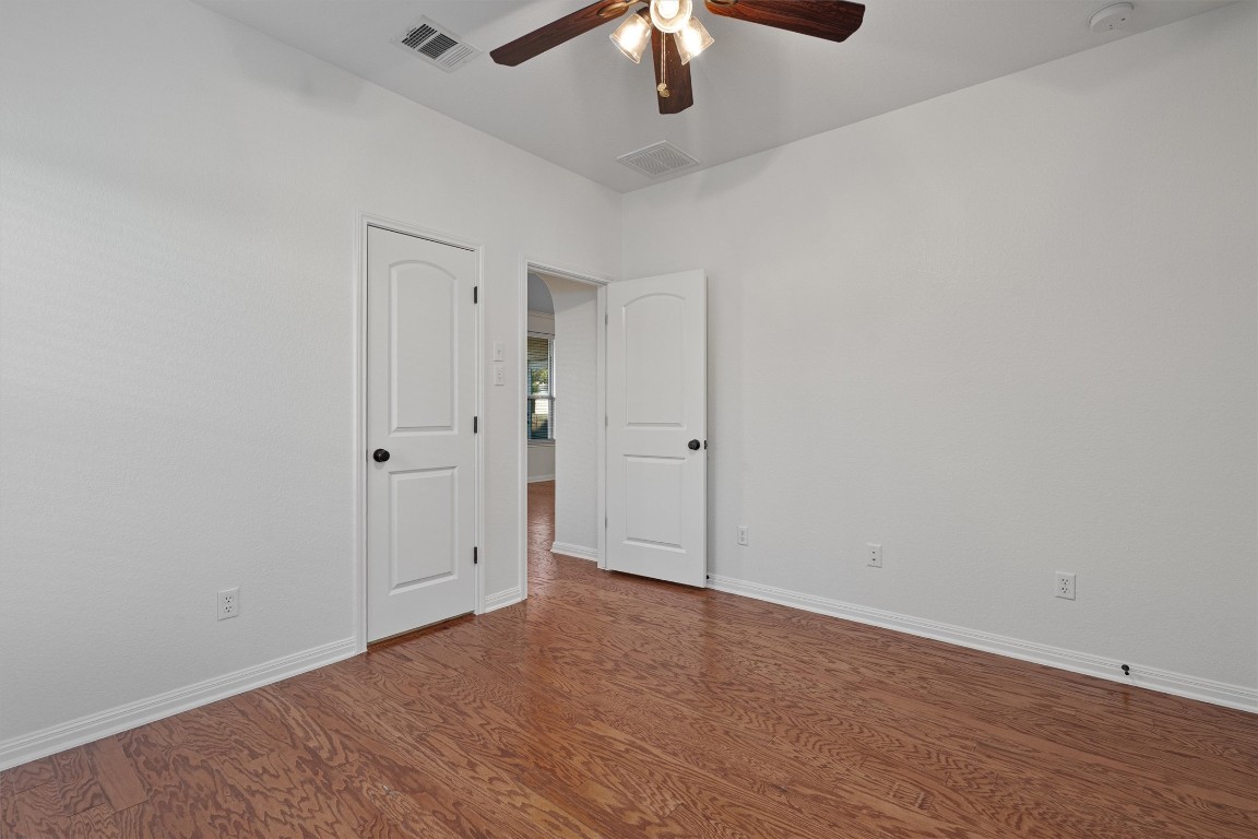 422 Village Commons Boulevard Georgetown, TX 78633 - Photo 19 of 40 wooden floor in an empty room