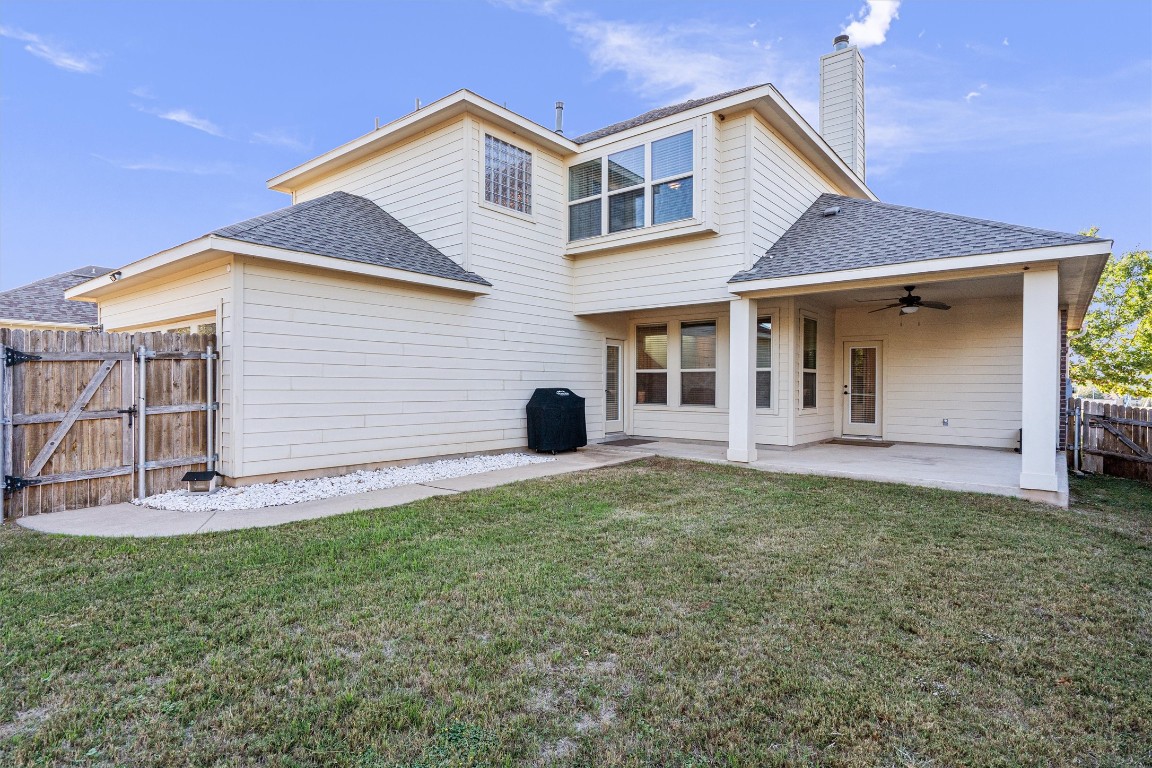 422 Village Commons Boulevard Georgetown, TX 78633 - Photo 35 of 40 a view of a house with backyard and porch