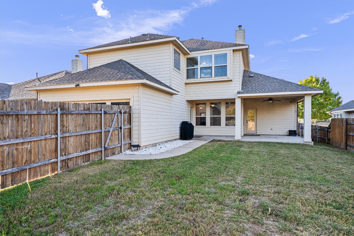 422 Village Commons Boulevard Georgetown, TX 78633 - Photo 36 of 40 a front view of a house with a yard