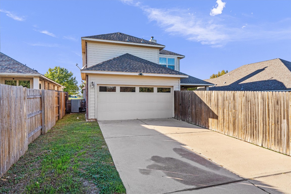 422 Village Commons Boulevard Georgetown, TX 78633 - Photo 37 of 40 a front view of a house with a yard