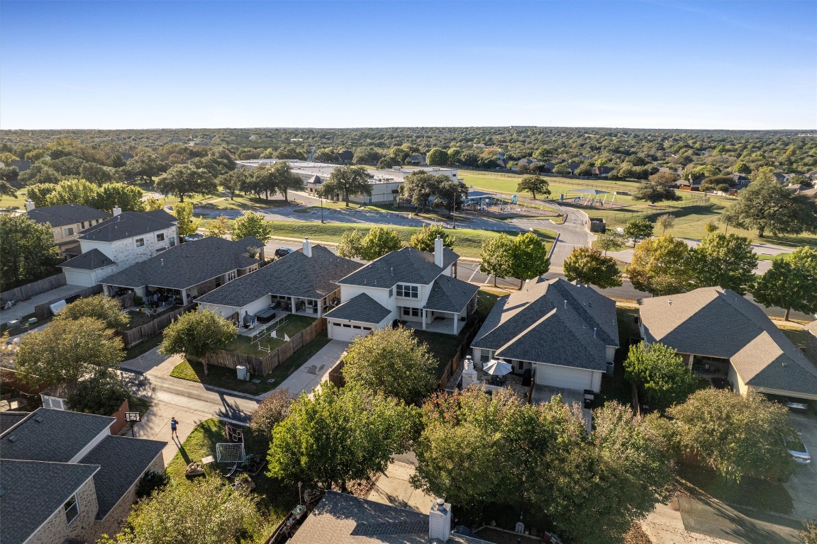 422 Village Commons Boulevard Georgetown, TX 78633 - Photo 38 of 40 an aerial view of residential houses with outdoor space and swimming pool