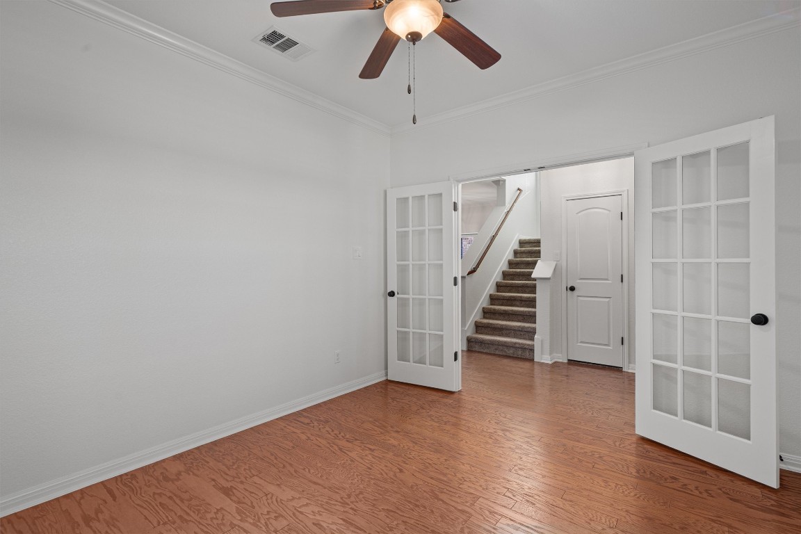 422 Village Commons Boulevard Georgetown, TX 78633 - Photo 5 of 40 a view of entryway and hall with wooden floor