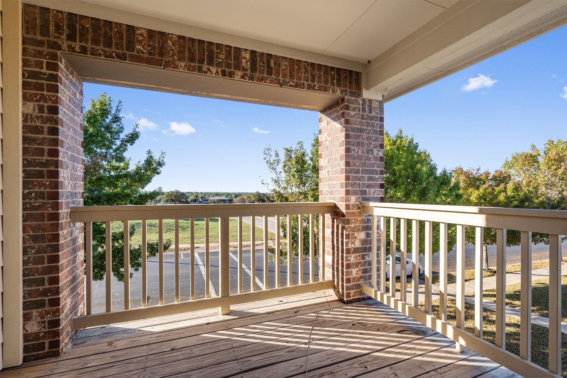 422 Village Commons Boulevard Georgetown, TX 78633 - Photo 7 of 40 a view of balcony with wooden floor and fence