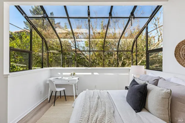 a view of a dining room with furniture and a window