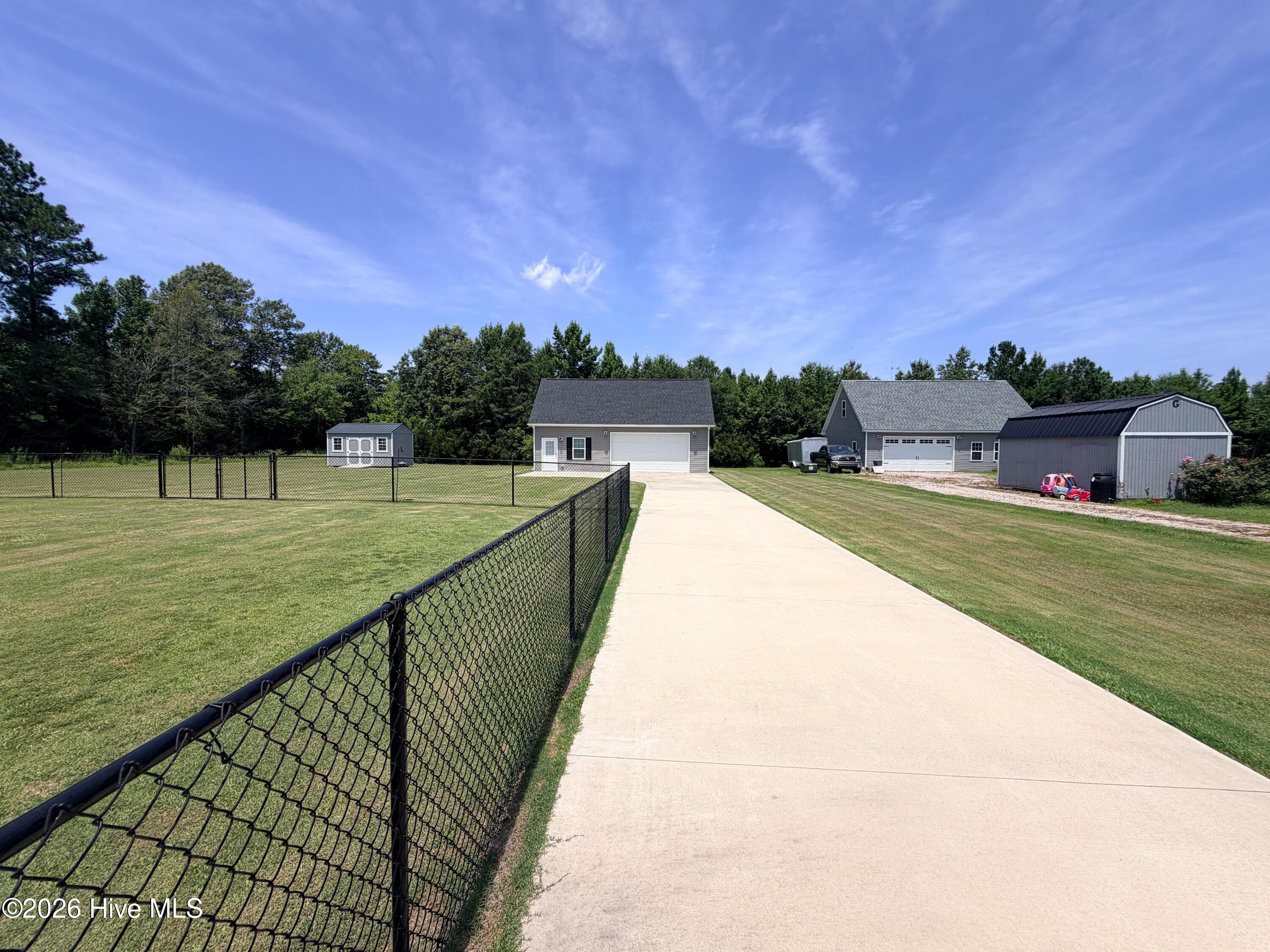 270 Keeter Barn Road South Mills, NC 27976 - Photo 27 of 45 CONCRETE DRIVEWAY TO 2 CAR DETACHED GARAGE AND WORKSHOP/GYM/FLEX
