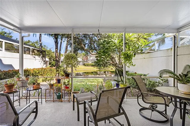 a view of a chairs and table in patio